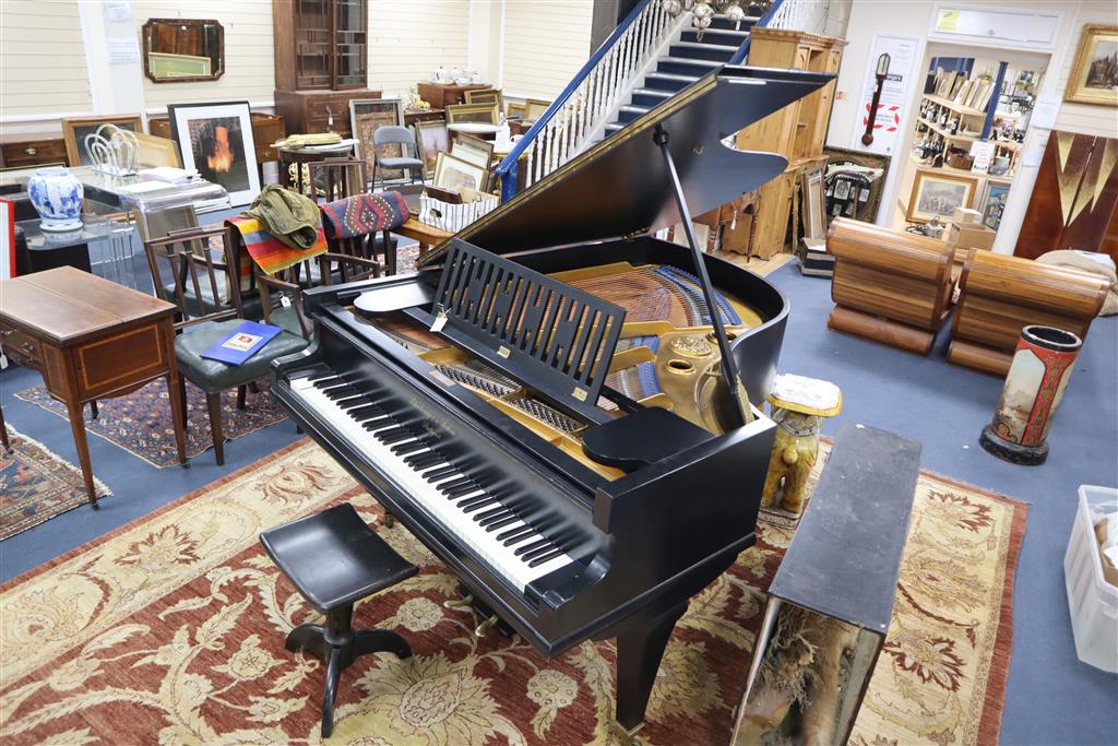 An early 20th century ebonised cased boudoir grand, by Schiedmayer & Son, Stuttgart, model 15, serial number 39536 on square legs, toge